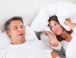 Angry Woman Trying To Sleep With Snoring Man