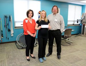 Robin McLey scholarship winner with Teresa Butler and Josh Lander in physical therapy department