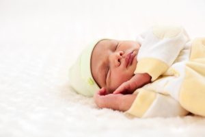 Closeup portrait of a one week old baby boy asleep